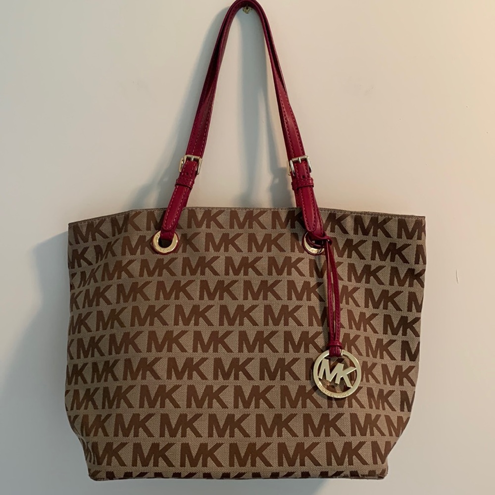 Michael Kors tote in brown with purple handles.
